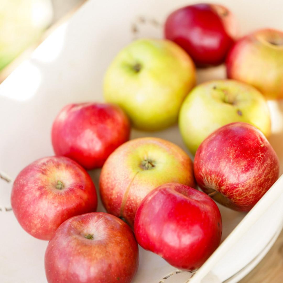 Yellow and Red apples in bowl