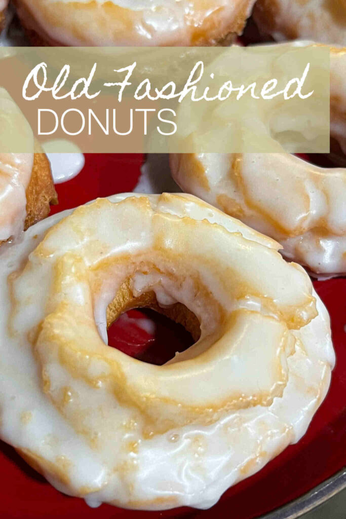 Homemade Old Fashioned Glazed Donuts on red dish